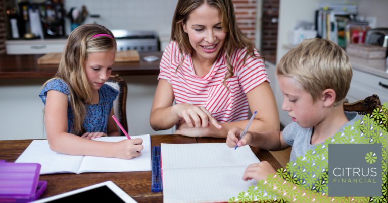 mother sitting at kitchen table with her son and daughter