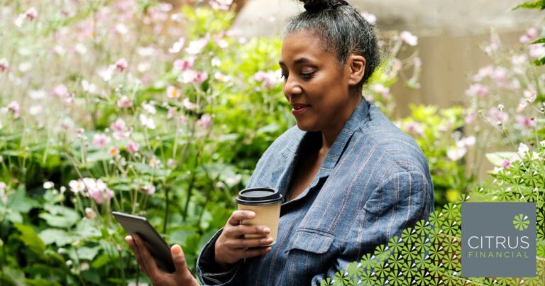 Mature woman on a bench reading an e-book, representing secure online activity and protection against scams in 2025.