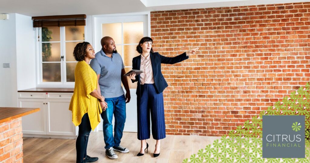 Estate agent showing a home to a couple