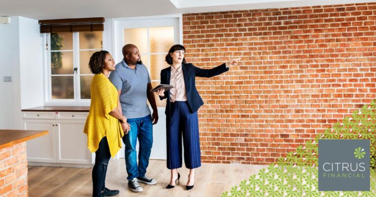 Estate agent showing a home to a couple