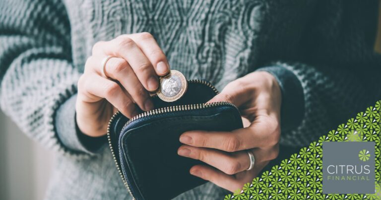 Person CAREFULLY PUTTING MONEY IN THEIR PURSE