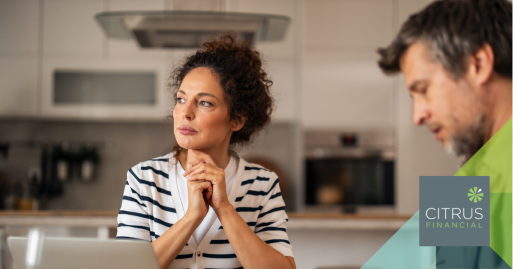 Woman in her kitchen thinking about her pension and retirement planning